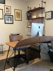 an office with a desk with a computer on it at MIIO HOTEL in San Vincenzo