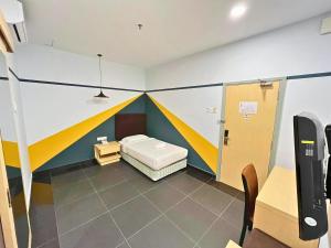Postel nebo postele na pokoji v ubytování Sky Hotel Selayang