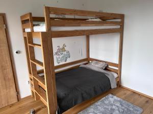 Postel nebo postele na pokoji v ubytování Krkonoše - apartmán s výhledem