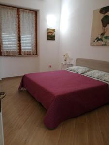 Postel nebo postele na pokoji v ubytování A Casa di Zia