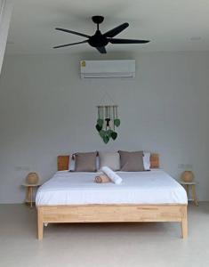 a bedroom with a bed with a ceiling fan at Villa Chacha à Lamai in Lamai +88 photos
