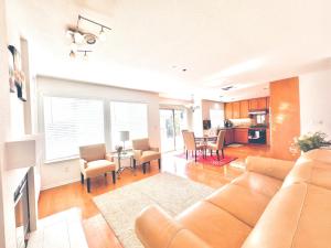 a living room with a couch and a dining room at Furnished 4BD-3BA Union City Home Central Location in Union City