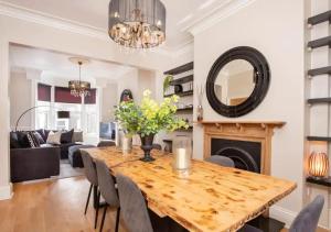 a dining room with a table and a fireplace at The Haven in York