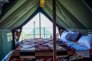 Ένα ή περισσότερα κρεβάτια σε δωμάτιο στο Morni Hills Retreat & Heaven +5 φωτογραφίες