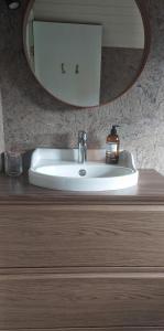 a sink in a bathroom with a mirror at Grund in Rauðamelur +66 photos