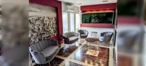 a waiting room with chairs and a window at PARADISO Hotel Ristorante in Reggio Calabria