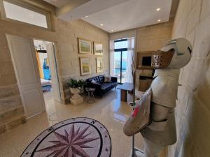 a living room with a statue of a horse at Grand Harbour View in Valletta