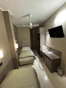 Postel nebo postele na pokoji v ubytování Hotel Parma