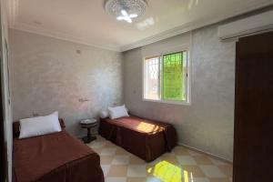 En eller flere senger på et rom på Cosy Appartement in Tiznit