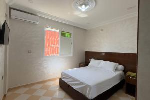 Postel nebo postele na pokoji v ubytování Cosy Appartement in Tiznit