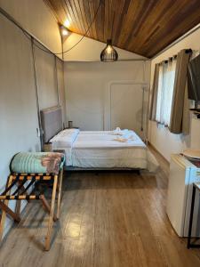 Katil atau katil-katil dalam bilik di Hospedaria dos Alpes