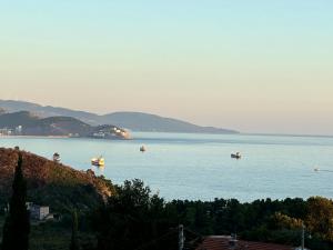 a group of boats in a large body of water at Sunset Pool Retreat in Zagrađe
