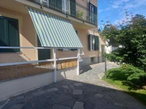 a building with a green roof on the side of it at Da Elena e Michele in Coazze