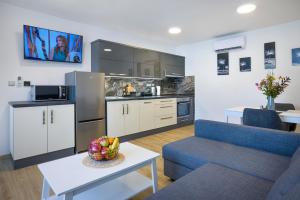 Kuchyň nebo kuchyňský kout v ubytování Apartmány U Betléma
