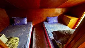Ένα ή περισσότερα κρεβάτια σε δωμάτιο στο Lama Homestay