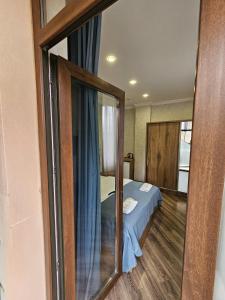 Postel nebo postele na pokoji v ubytování Hotel Giorgi Tbilisi