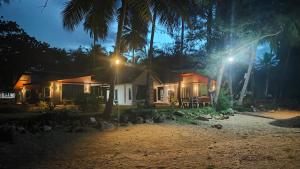 a house with a street light in front of it at Baan rabianglay 1 in Ban Hin Sam Kon