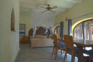 a bedroom with a bed and a table and chairs at Casa Buenaventura in Calonge +47 photos