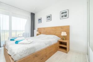 Łóżko lub łóżka w pokoju w obiekcie Westin House Resort Kołobrzeg Apartament 410