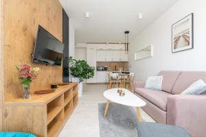 Telewizja i/lub zestaw kina domowego w obiekcie Westin House Resort Kołobrzeg Apartament 410