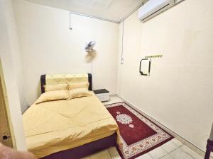 Ein Bett oder Betten in einem Zimmer der Unterkunft Radzz Homestay
