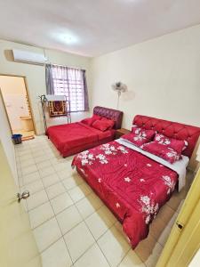 Ein Bett oder Betten in einem Zimmer der Unterkunft Radzz Homestay