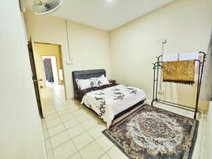 Ein Bett oder Betten in einem Zimmer der Unterkunft Radzz Homestay