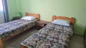 Postel nebo postele na pokoji v ubytování Hotel Tukums