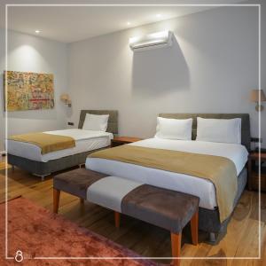 A bed or beds in a room at Misafir Suites 8 Istanbul