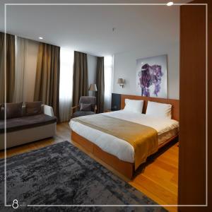 A bed or beds in a room at Misafir Suites 8 Istanbul
