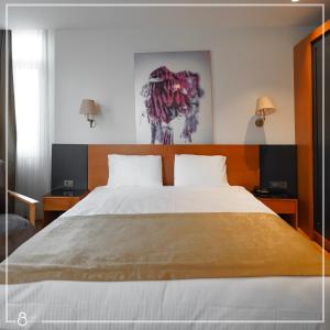A bed or beds in a room at Misafir Suites 8 Istanbul