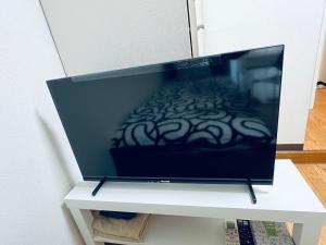TV a/nebo společenská místnost v ubytování ビアン国立
