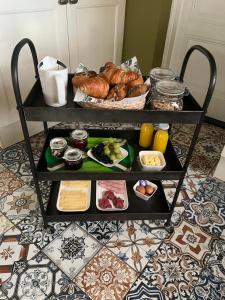 a cart filled with different types of food on a floor at B&B - Make a Wisch in Silvolde