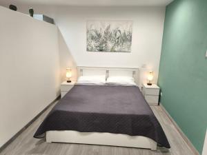 Postel nebo postele na pokoji v ubytování Studio Apartments Salvo 7