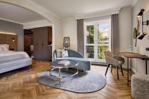 a hotel room with a bed and a table at The Westin Grand Berlin in Berlin