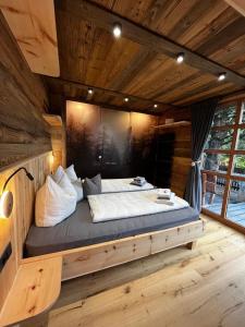 Postel nebo postele na pokoji v ubytování Chalet Gletscherblick Stubai