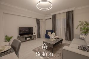 TV a/nebo společenská místnost v ubytování Sokon Residence - New Cairo - El Rehab
