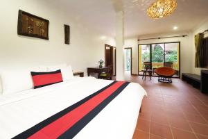 Postel nebo postele na pokoji v ubytování Le Jardin d'Angkor Hotel & Resort