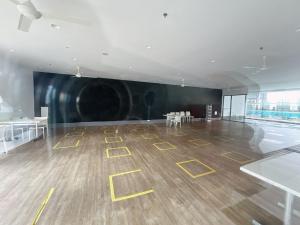 a large empty room with yellow drawings on the floor at PJ cozy grand design home 1-10 pax 5 min to Sunway in Sungai Way +31 photos