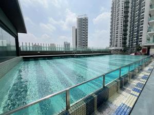 a large swimming pool on the roof of a building at PJ cozy grand design home 1-10 pax 5 min to Sunway in Sungai Way