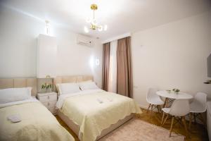 Postel nebo postele na pokoji v ubytování Golden Palace