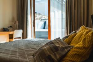 Ένα ή περισσότερα κρεβάτια σε δωμάτιο στο Resort Líšenský Dvůr