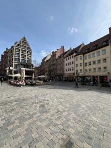 a city square with buildings and a street at Sahara Hosting Apartments Nürnberg City Room 1 in Nuremberg