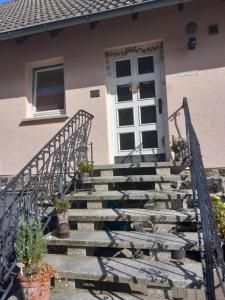 a set of stairs leading to a house with a door at Haus Hopfgarten in Schwalmtal