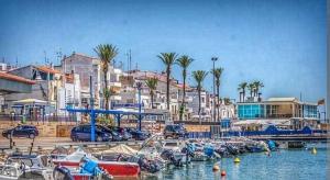 a bunch of boats are docked in a harbor at Apartamento en primera línea de mar!! in Alcanar
