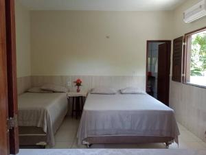 En eller flere senge i et værelse på Casa Biana