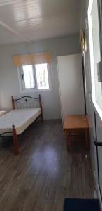 Ένα ή περισσότερα κρεβάτια σε δωμάτιο στο Kiparissoupoli