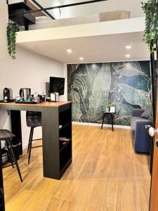 an office with a desk and a wall with plants at Luxury apartment - La fenice in Bari