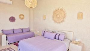 Postel nebo postele na pokoji v ubytování Lalla Essaouira, Villa Najma avec piscine pour 15 personnes