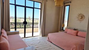Postel nebo postele na pokoji v ubytování Lalla Essaouira, Villa Najma avec piscine pour 15 personnes + 32 fotografií